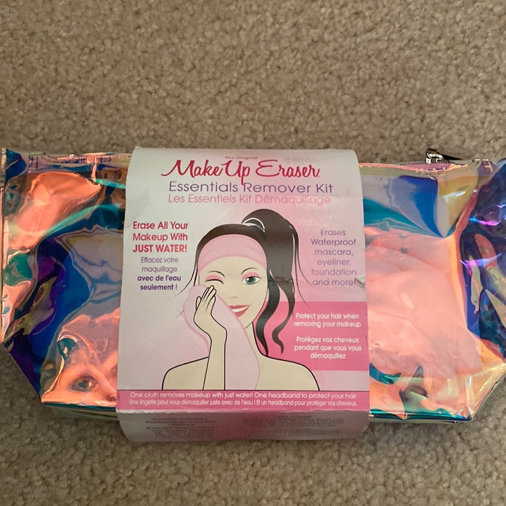 Makeup eraser essentials remover kit. New. Comes in iridescent pouch.